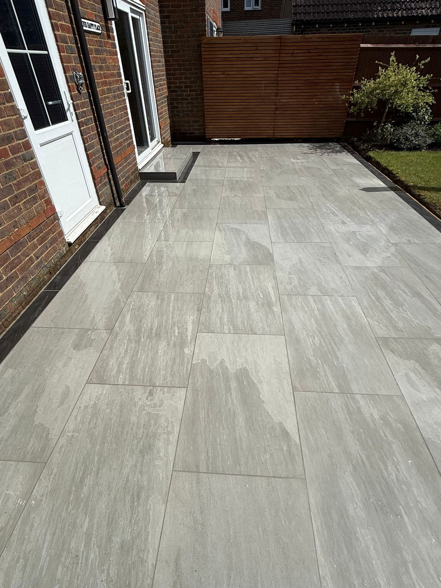 Paved path and patio area with level finish and quality detailing